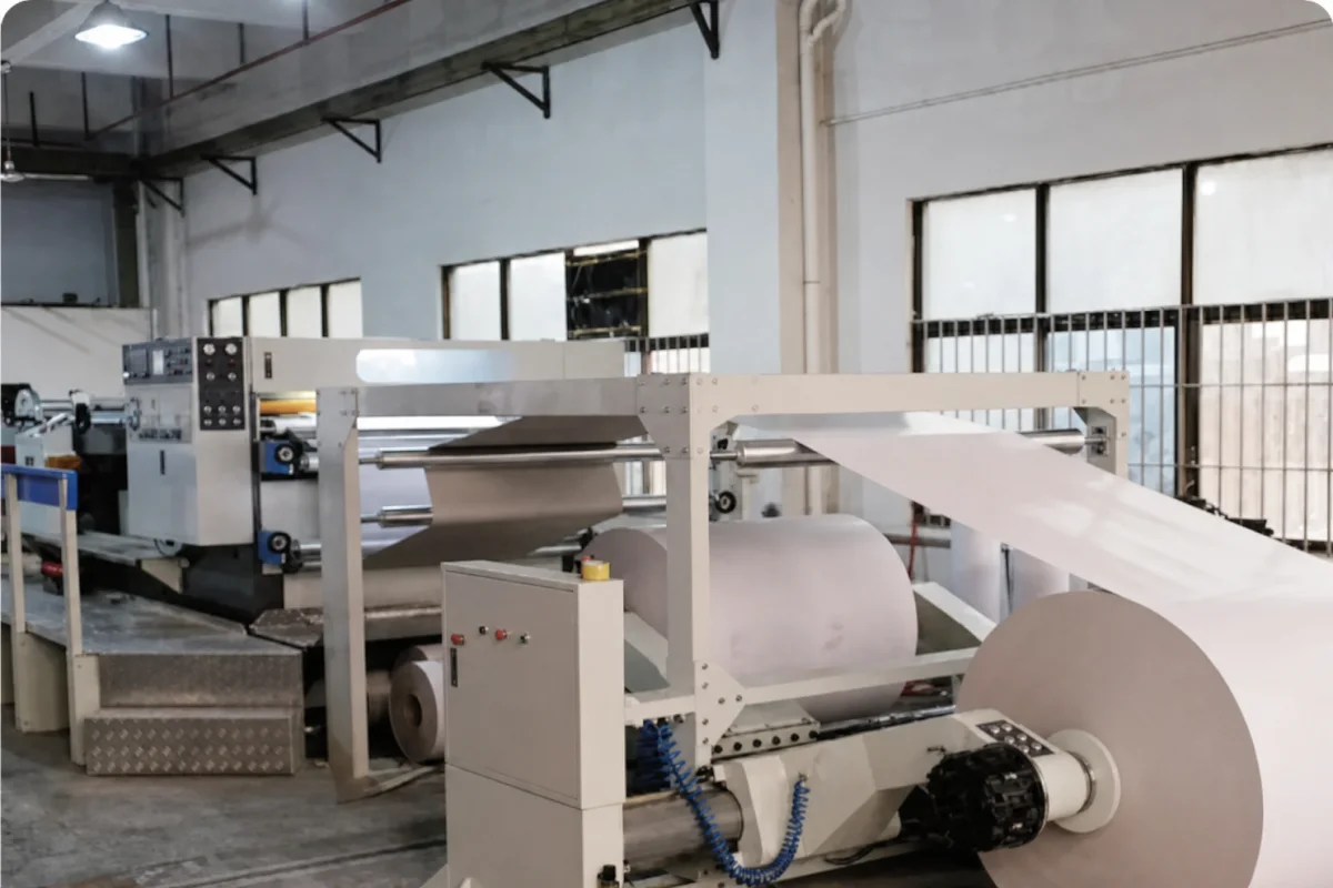 Paper feeding and cutting equipment in a corrugated display production facility
